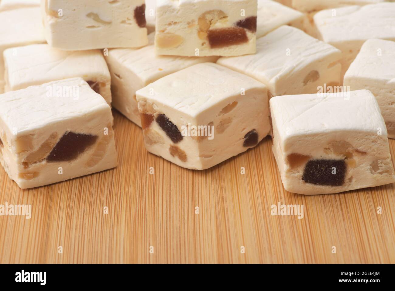 Close up of nougat with dried fruit and nut on wooden surface Stock Photo