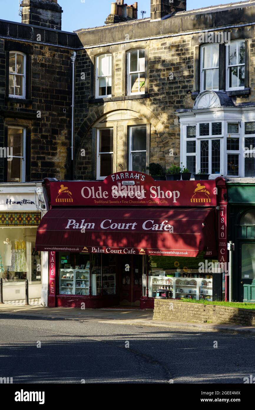 Harrogate's Farrah's Old Sweet Shop, with its dark crimson canopy and Palm Court Cafe above it, North Yorkshire, England, UK. Stock Photo