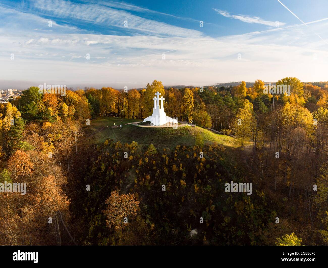 Aerial view of the Three Crosses monument overlooking Vilnius Old Town on sunset. Vilnius landscape from the Hill of Three Crosses, located in Kalnai Stock Photo