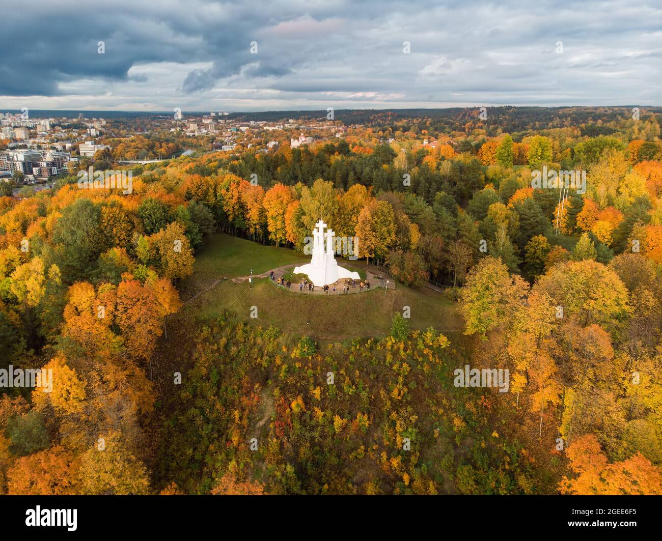 Aerial view of the Three Crosses monument overlooking Vilnius Old Town on sunset. Vilnius landscape from the Hill of Three Crosses, located in Kalnai Stock Photo