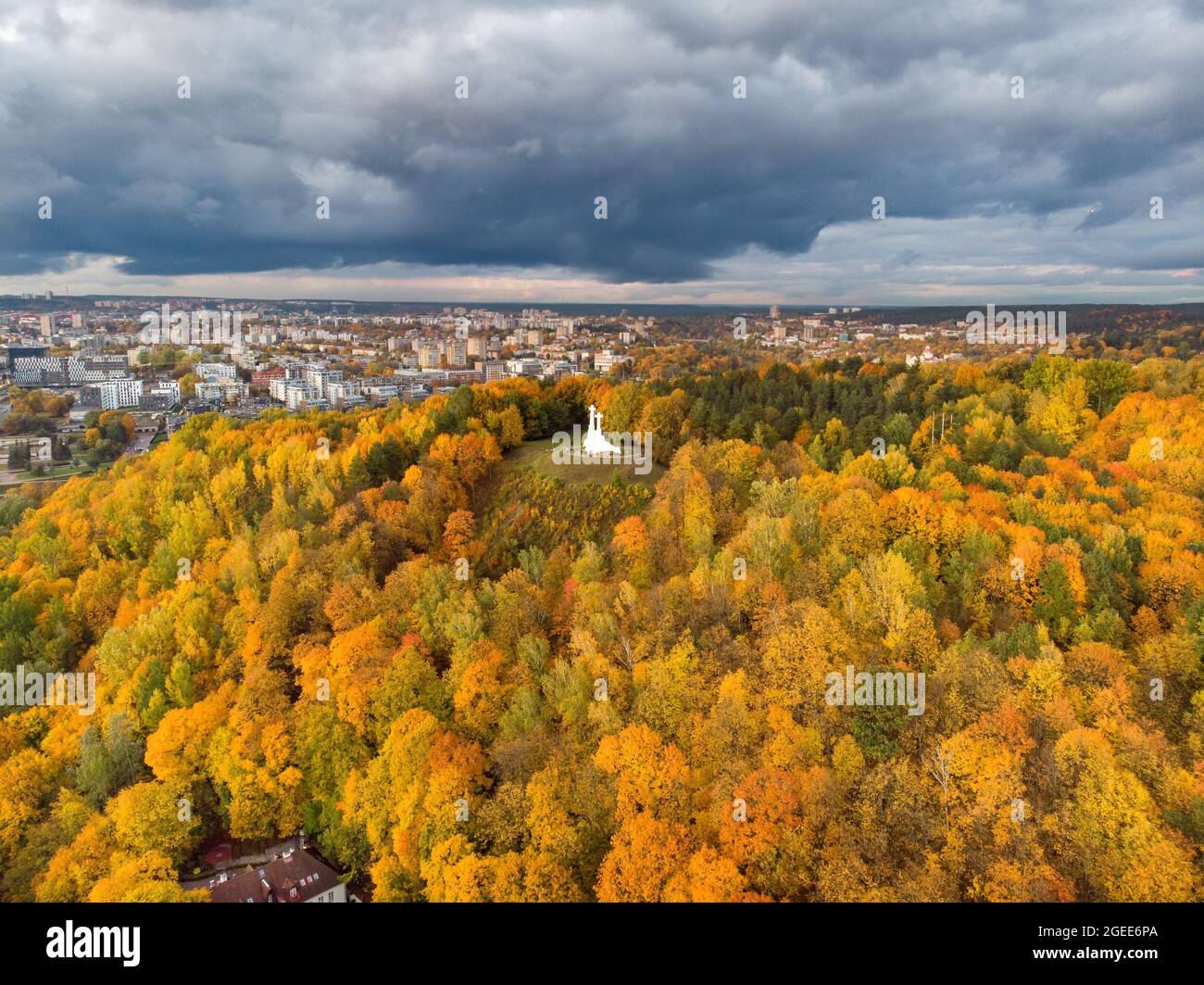 Aerial view of the Three Crosses monument overlooking Vilnius Old Town on sunset. Vilnius landscape from the Hill of Three Crosses, located in Kalnai Stock Photo