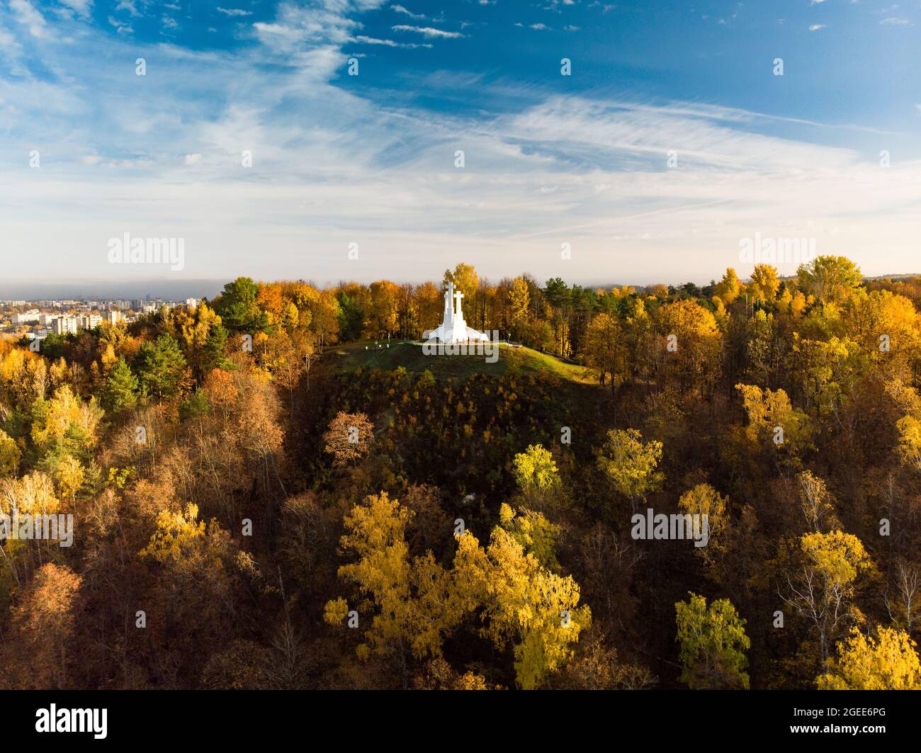 Aerial view of the Three Crosses monument overlooking Vilnius Old Town on sunset. Vilnius landscape from the Hill of Three Crosses, located in Kalnai Stock Photo