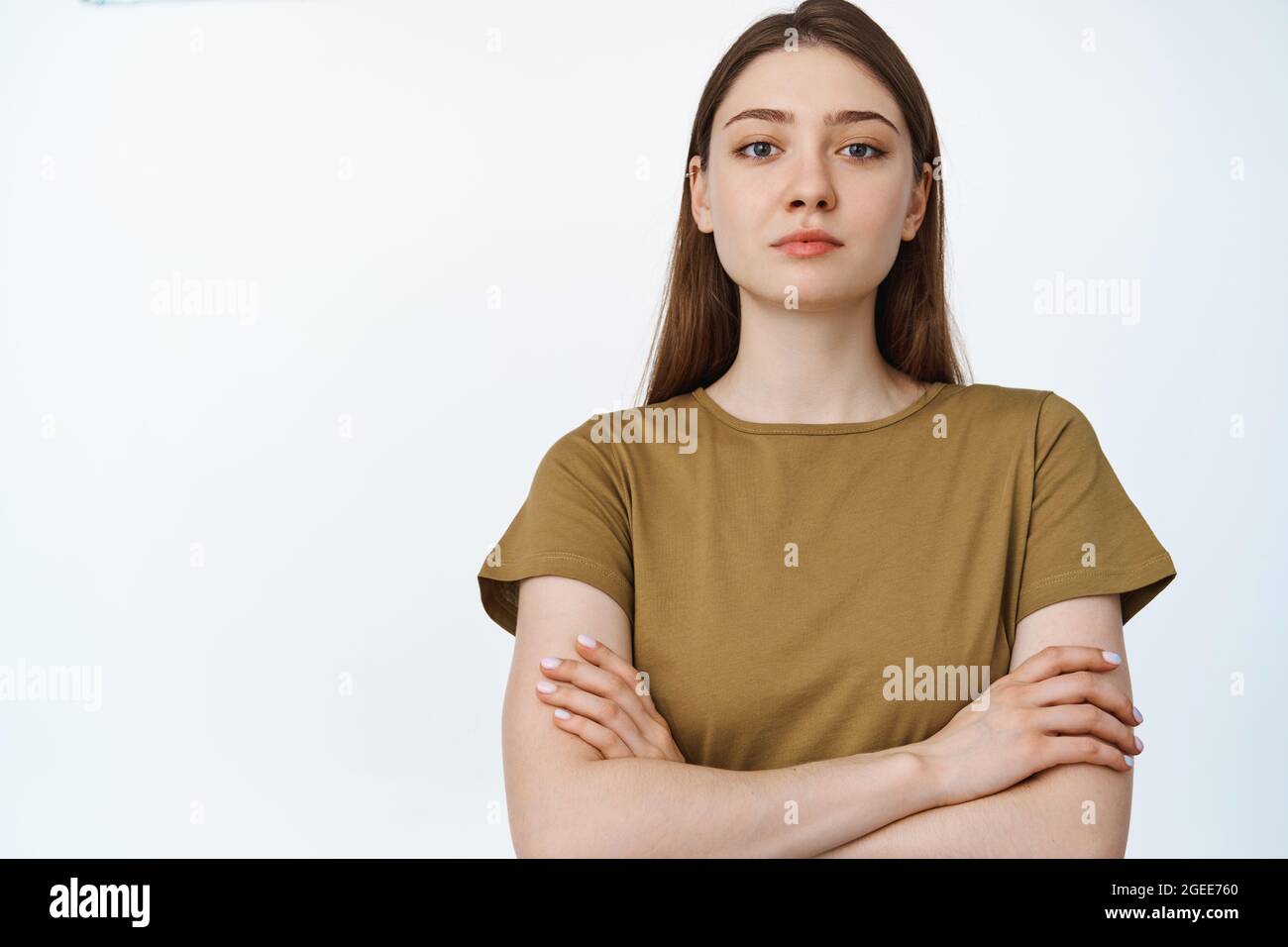 Portrait of young confident woman cross arms on chest, looking