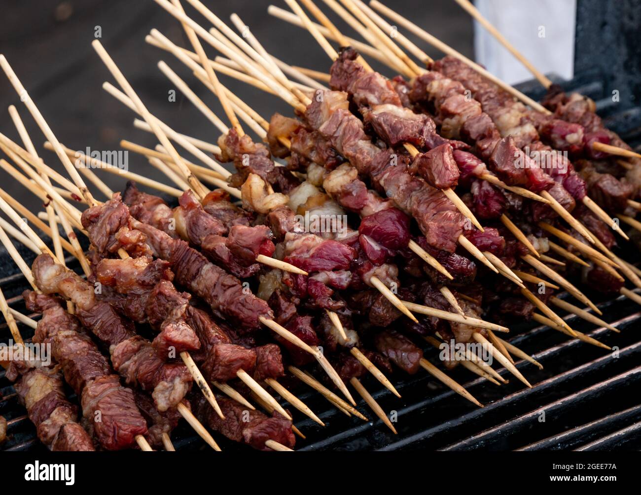 typical Italian arrosticini of lamb Arrosticini on wooden skewer Stock Photo