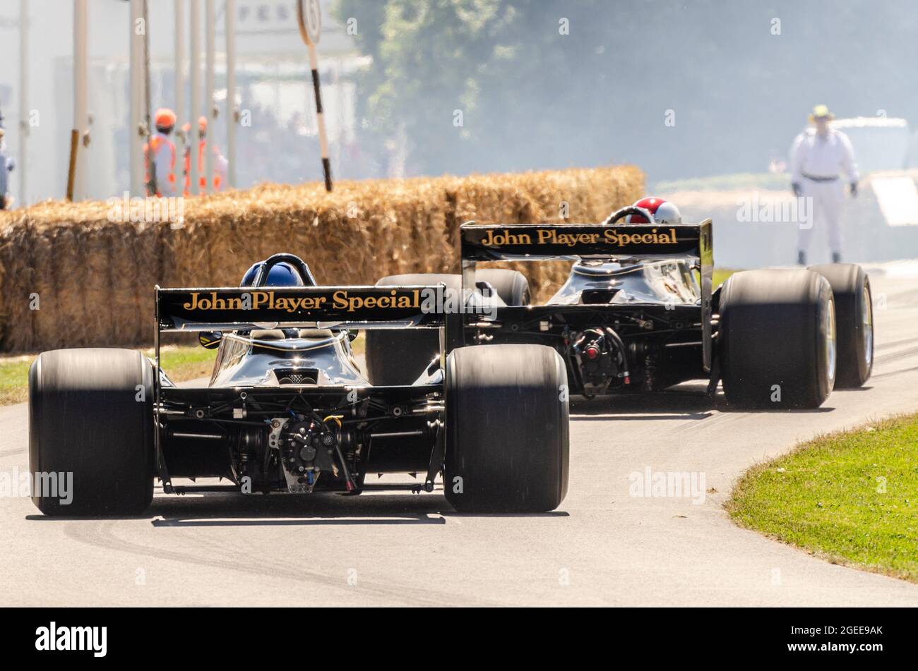 Historic Lotus 79 Formula 1, Grand Prix racing cars driving up the hill climb at the Goodwood Festival of Speed motor racing event 2014. Rear view Stock Photo