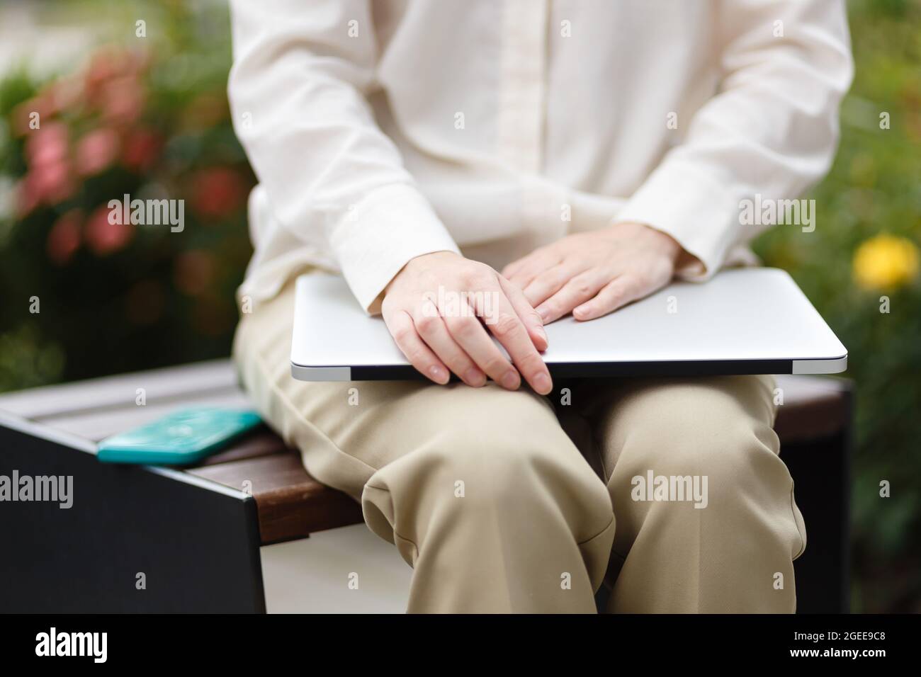 female entrepreneur hold smartphone and laptop Stock Photo