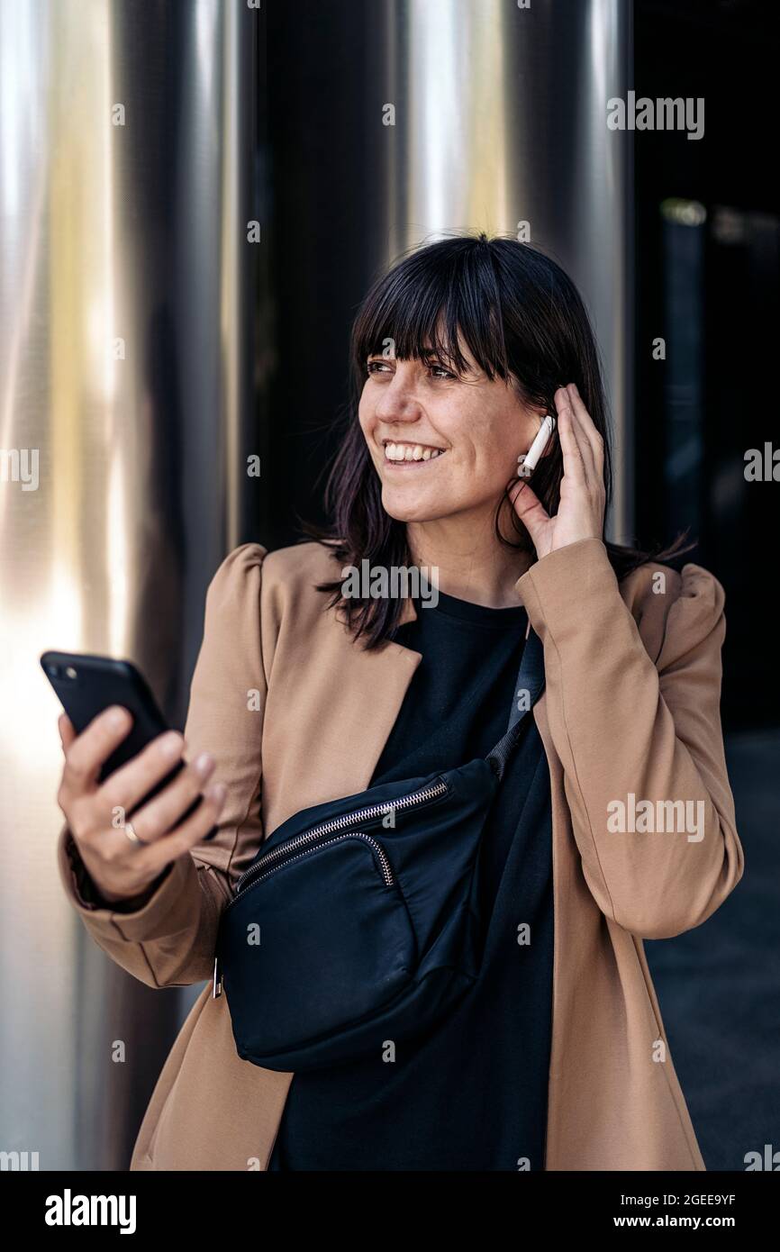 Caucasian businesswoman talking on the phone outdoors. Stock Photo
