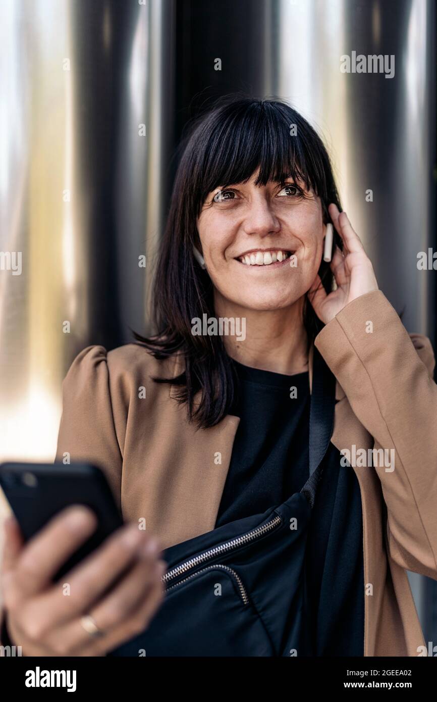 Caucasian businesswoman talking on the phone outdoors. Stock Photo