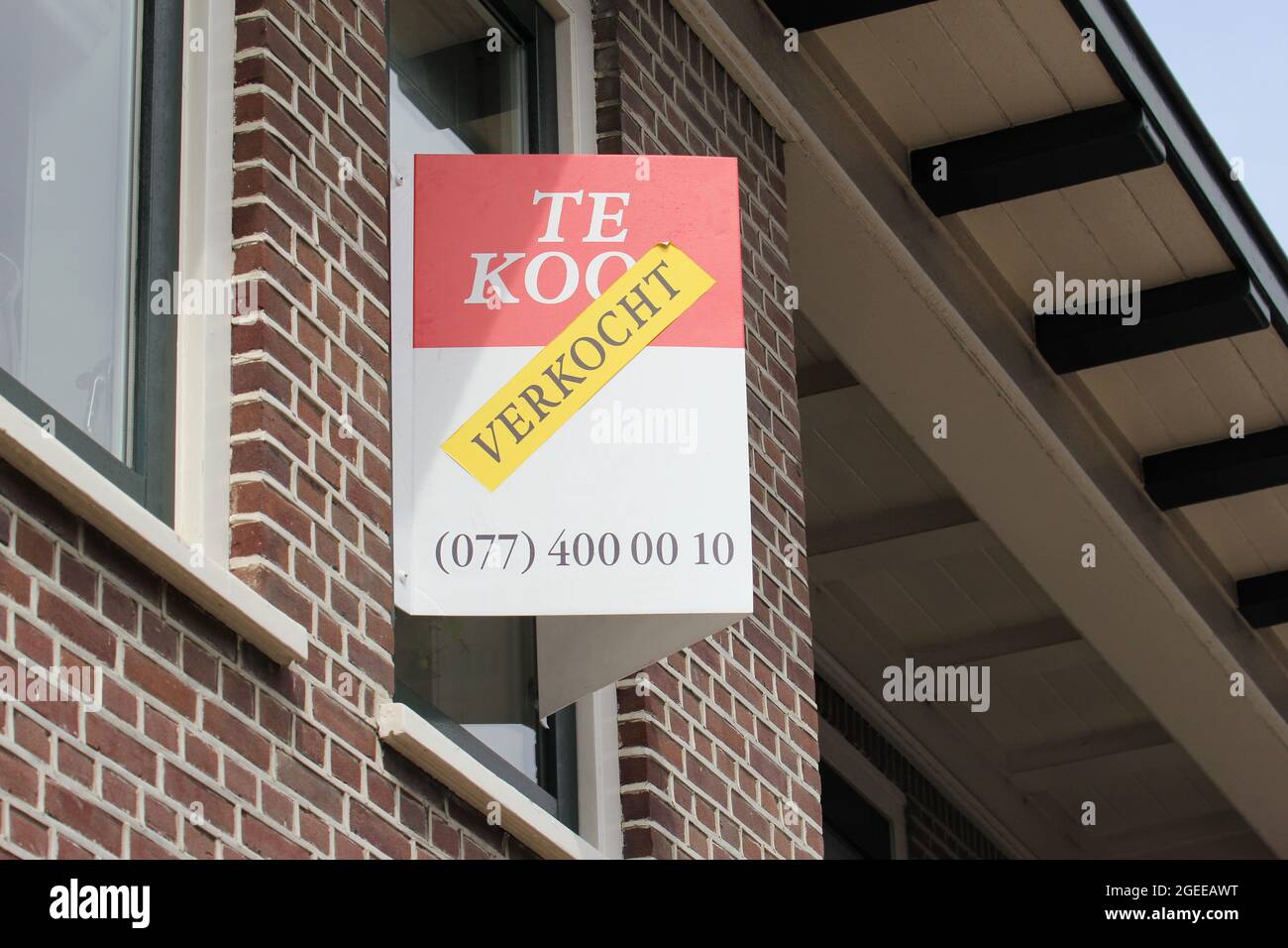 real estate agent sign at sold house in the Netherlands Stock Photo