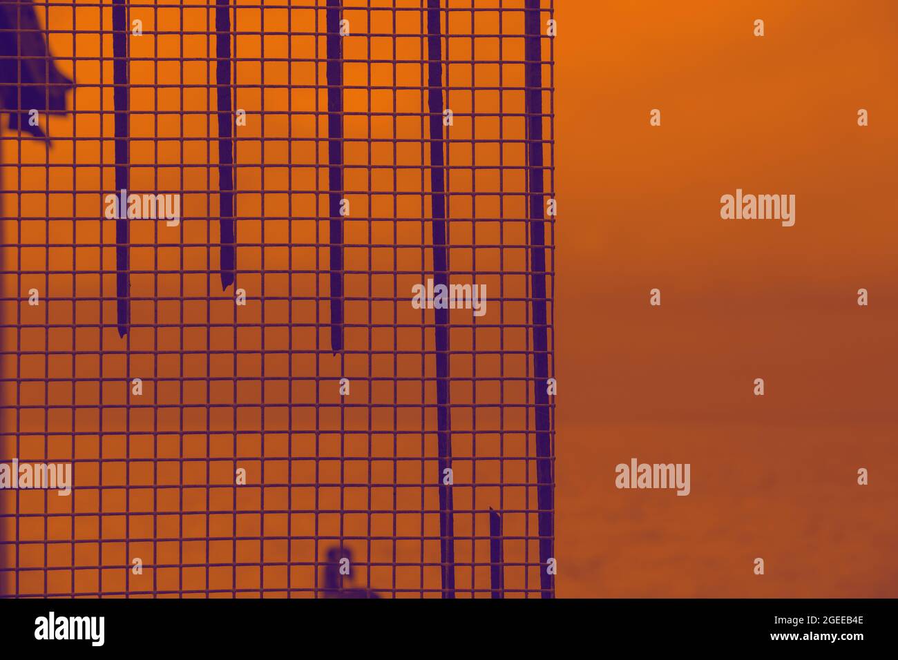 Duocolor image of a pattern made off iron objects, seen outdoors. Stock Photo