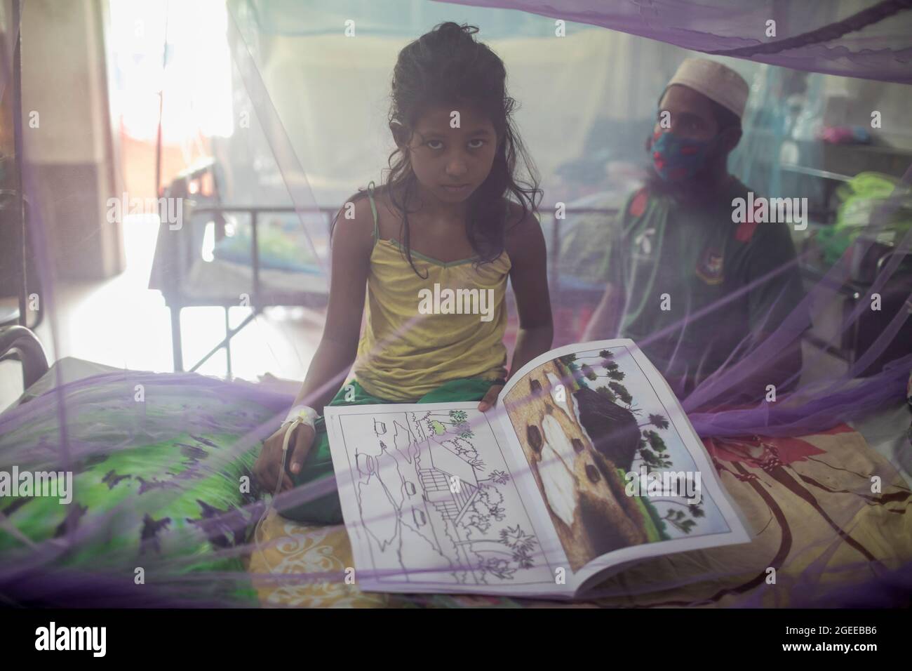 A child seen drawing cartoons inside a mosquito net during daytime at Children's Hospital.With Bangladesh grappling with the Covid-19 pandemic, dengue poses a great threat to the country's children. At present, severe dengue affects most Asian countries and has become a leading cause of hospitalizations and deaths among children as well as adults in these regions, according to WHO. In such dire circumstances, some Dhaka residents are lighting mosquito-repelling incenses even during the day to steer clear of the mosquito-borne viral disease. Stock Photo