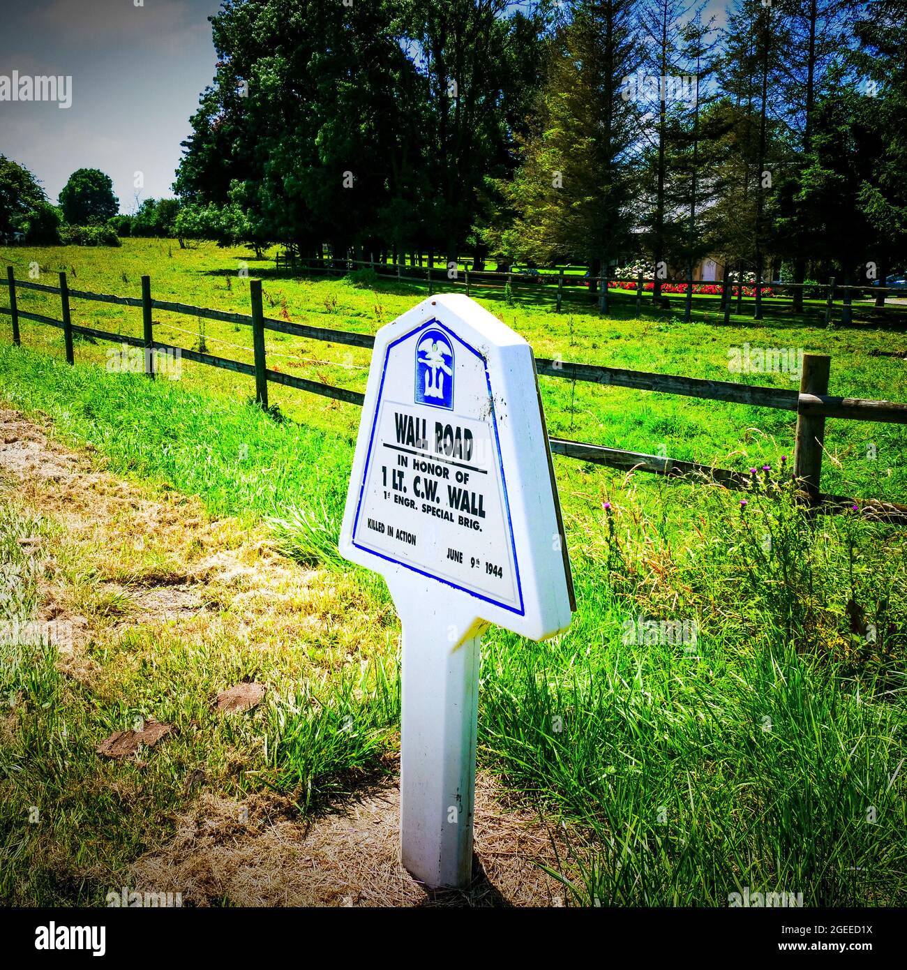 Road sign paying homage to american soldier, Audouville, Manche