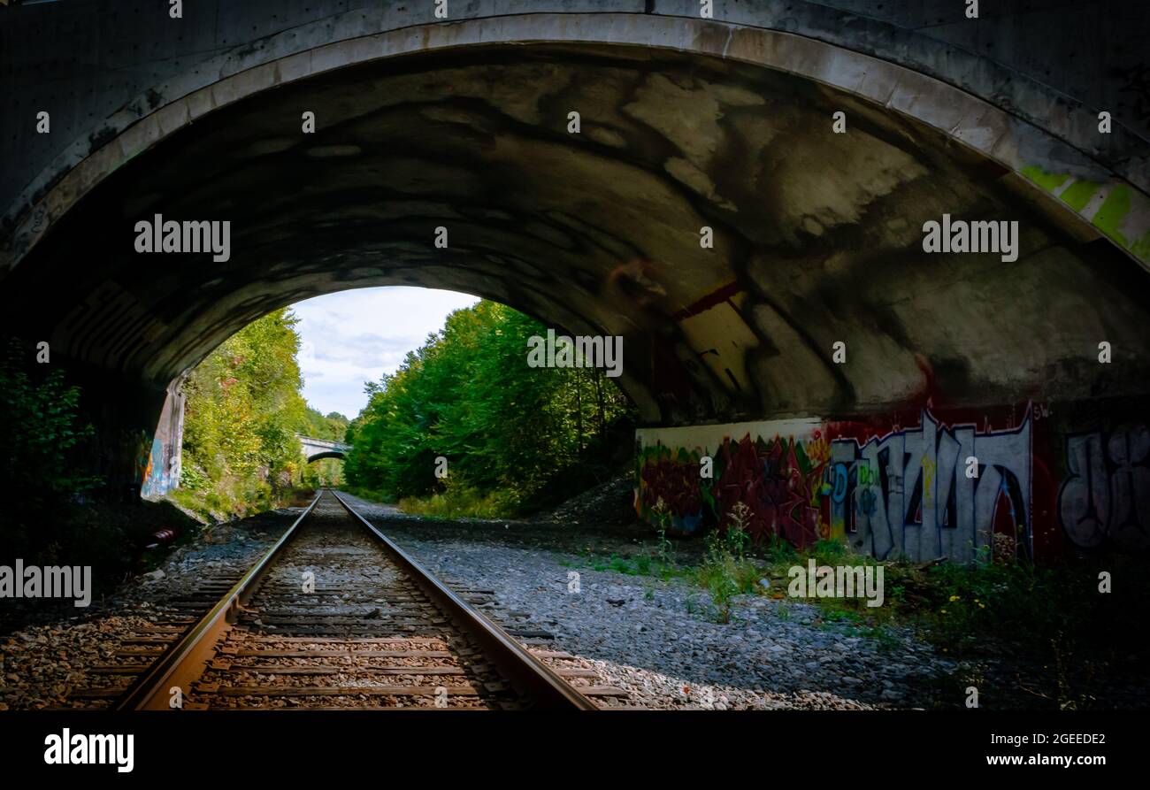 street art in tunnel that fallows a train track in nova scotia Stock Photo