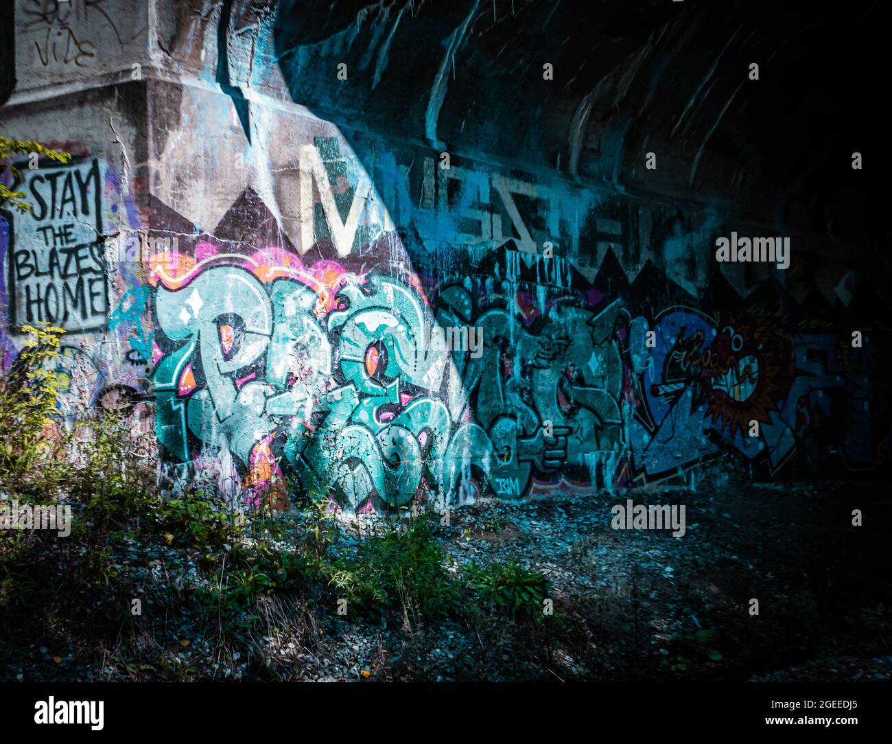 street art in tunnel that fallows a train track in nova scotia Stock Photo