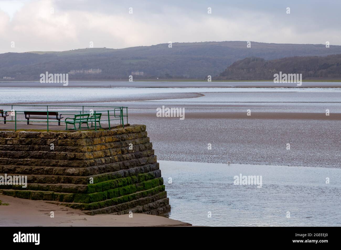The Arnside Bore, an amazing wave that travels upstream in the Kent Estuary in Cumbria on the highest spring tides, passing close to Arnside Pier Stock Photo