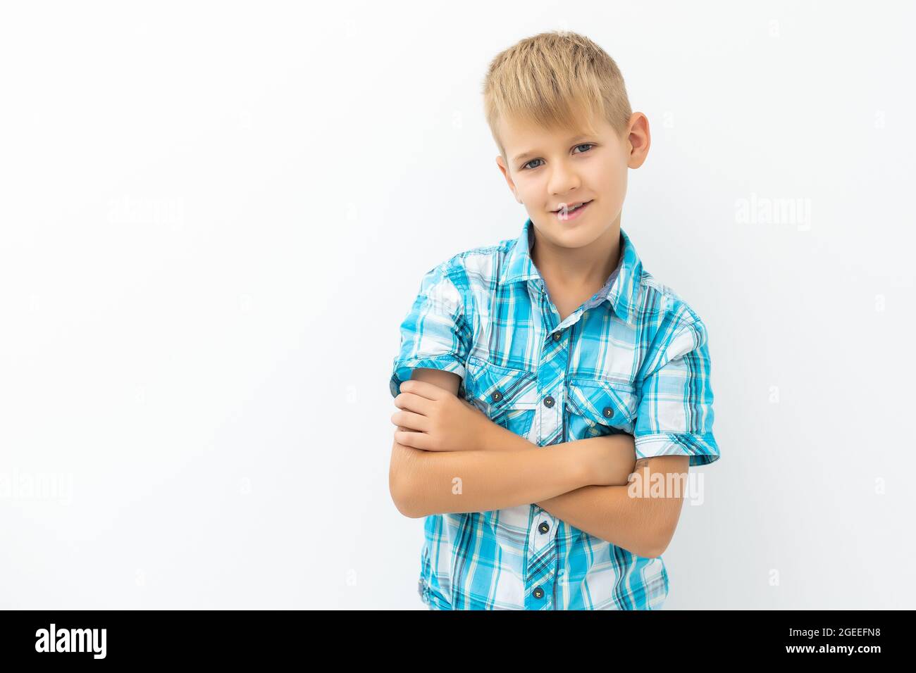 Photo of adorable young happy boy looking at camera Stock Photo - Alamy