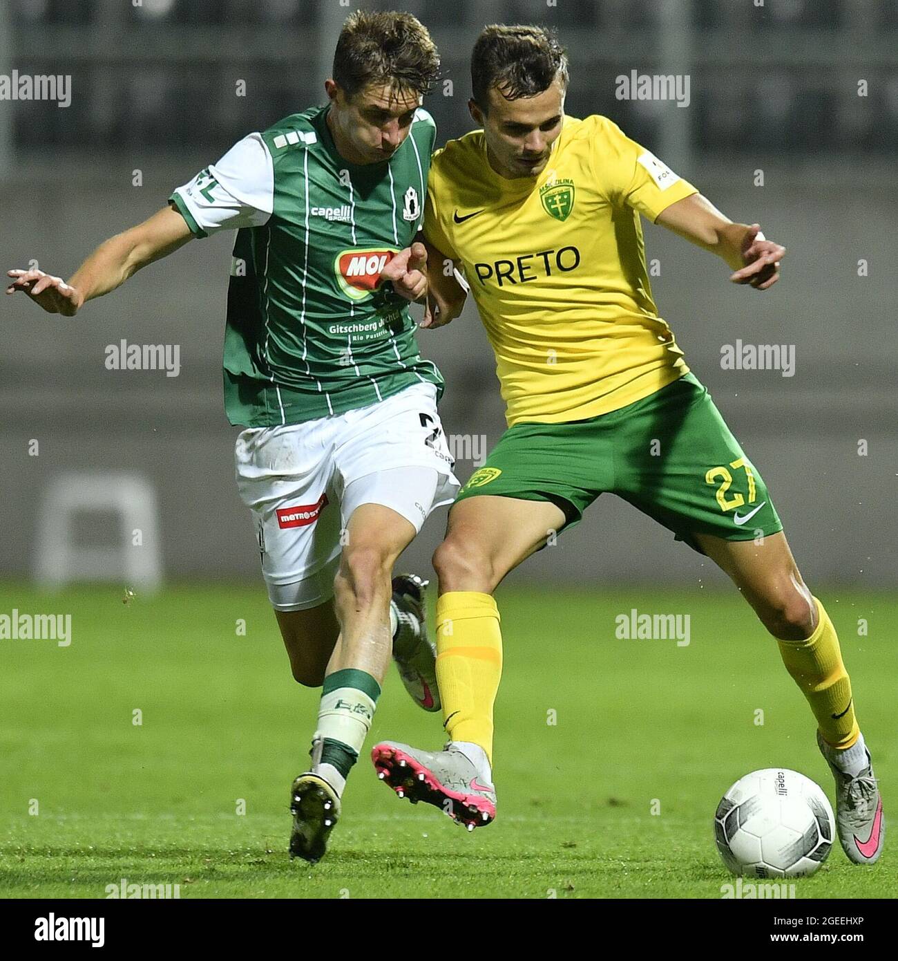 Jablonec Nad Nisou, Czech Republic. 19th Aug, 2021. From left Dominik  Plestil of Jablonec and Branislav Sluka of Zilina in action during the  European Conference League 4th qualifying round, 1st leg football