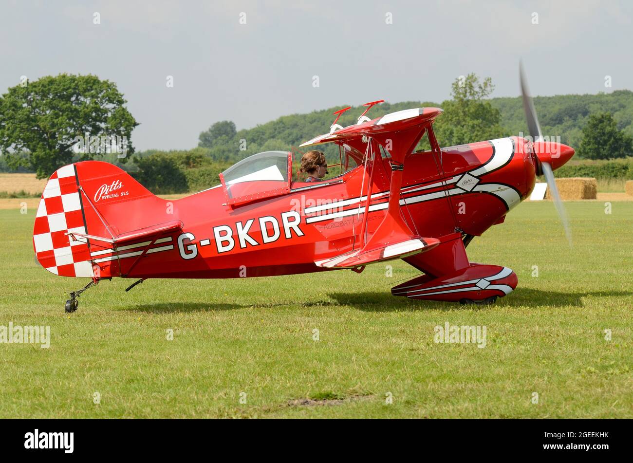 Female pilot Lauren Richardson preparing to display her Pitts Special aerobatic plane at an airshow. Married name Lauren Wilson. Grass airfield Stock Photo
