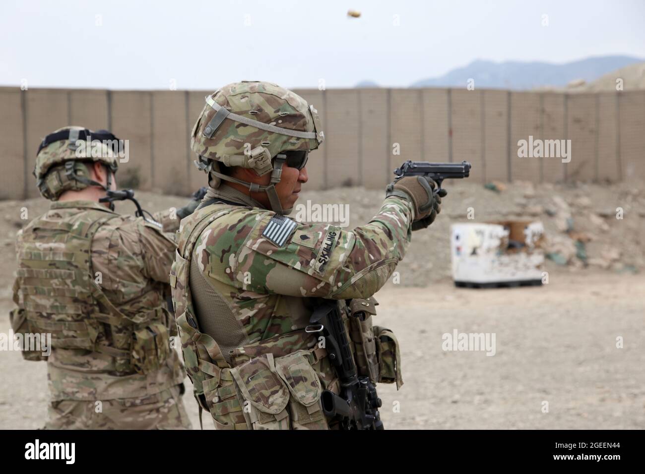 U.S. Army soldiers assigned to Security Forces Advise and Assist Team 28, Task Force 3/101, fire M9 Beretta pistols during a live-fire small-arms range on Camp Parsa, Khowst province, Afghanistan, Jan. 30, 2013. (U.S. Army photo by Sgt. Kimberly Trumbull / Released) Stock Photo