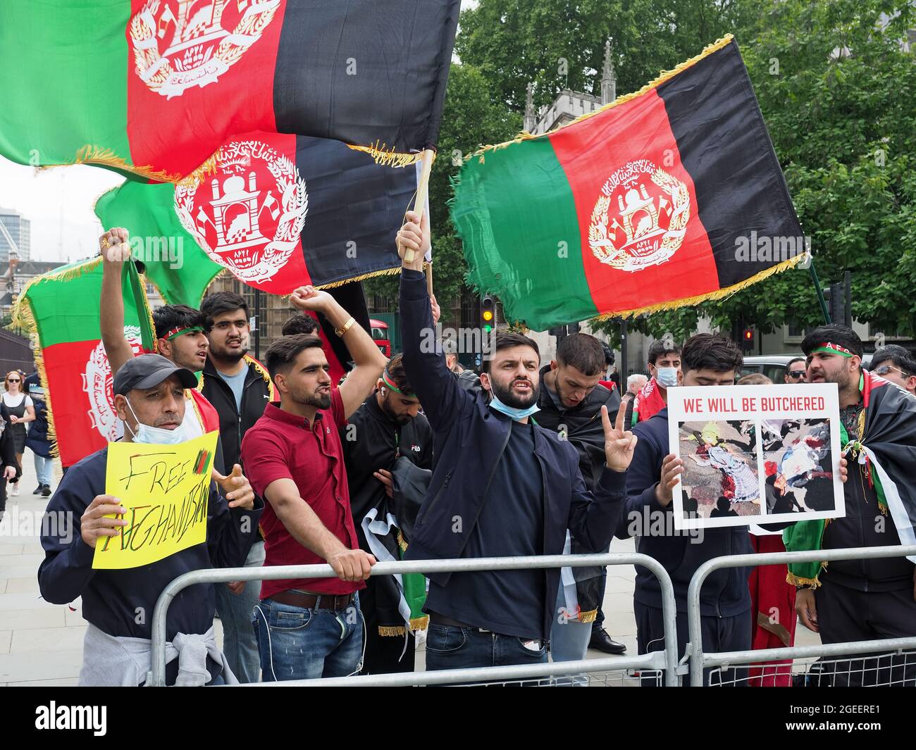 A group of Afghans and former Afghan interpreters protesting outside the UK Westminster Parliament in London on 18 August 2021 Stock Photo