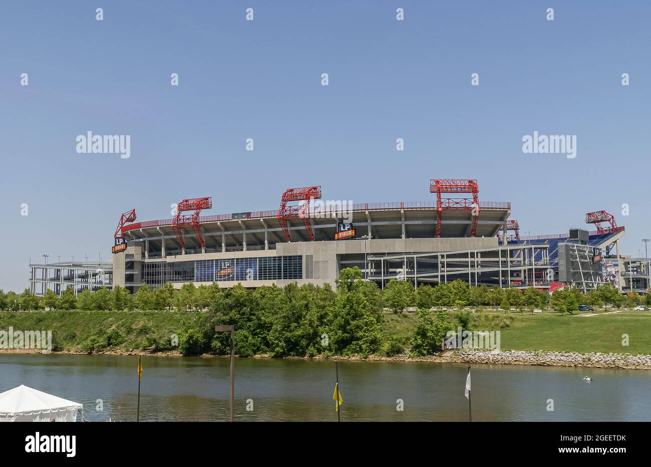Nashville, TN, USA - May 19, 2007: Downtown. Giant LP Field Stadium, Nissan since 2015, where NFL Titans play under blue sky with green foliage and Cu Stock Photo