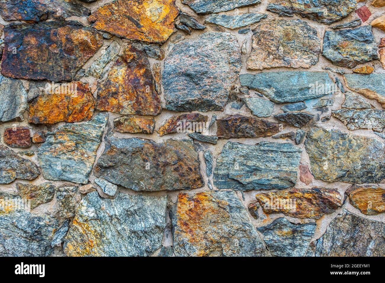 Natural colorful stones wall background for wallpapers Stock Photo - Alamy