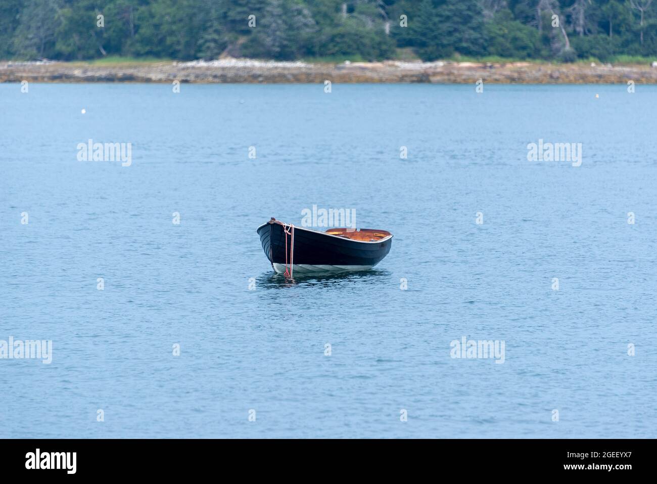 Wooden Rowboat on Mooring Stock Photo