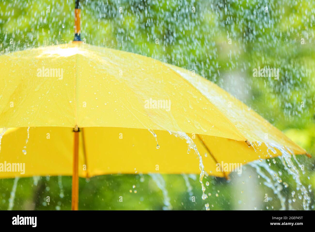 Open umbrella under falling rain drops outdoors Stock Photo Alamy