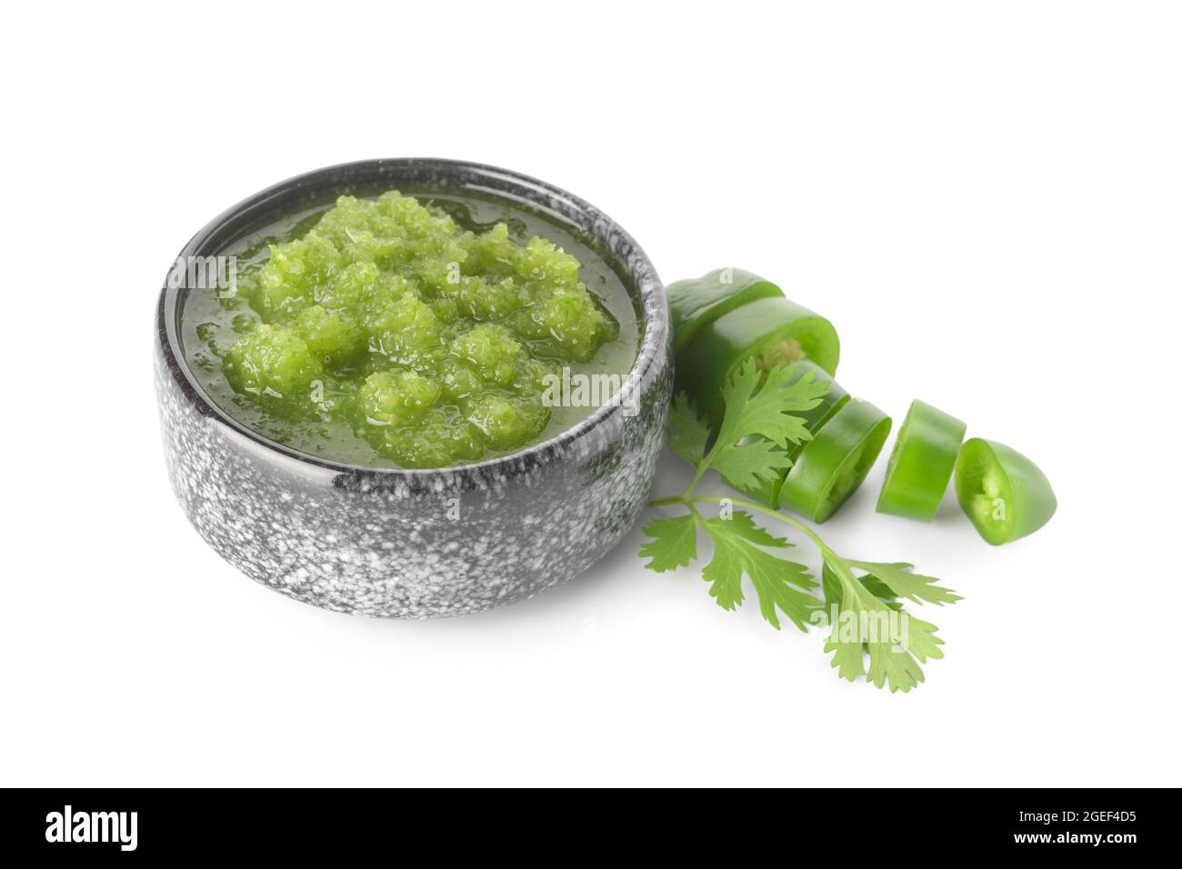 Bowl of Tomatillo Salsa Verde sauce on white background Stock Photo