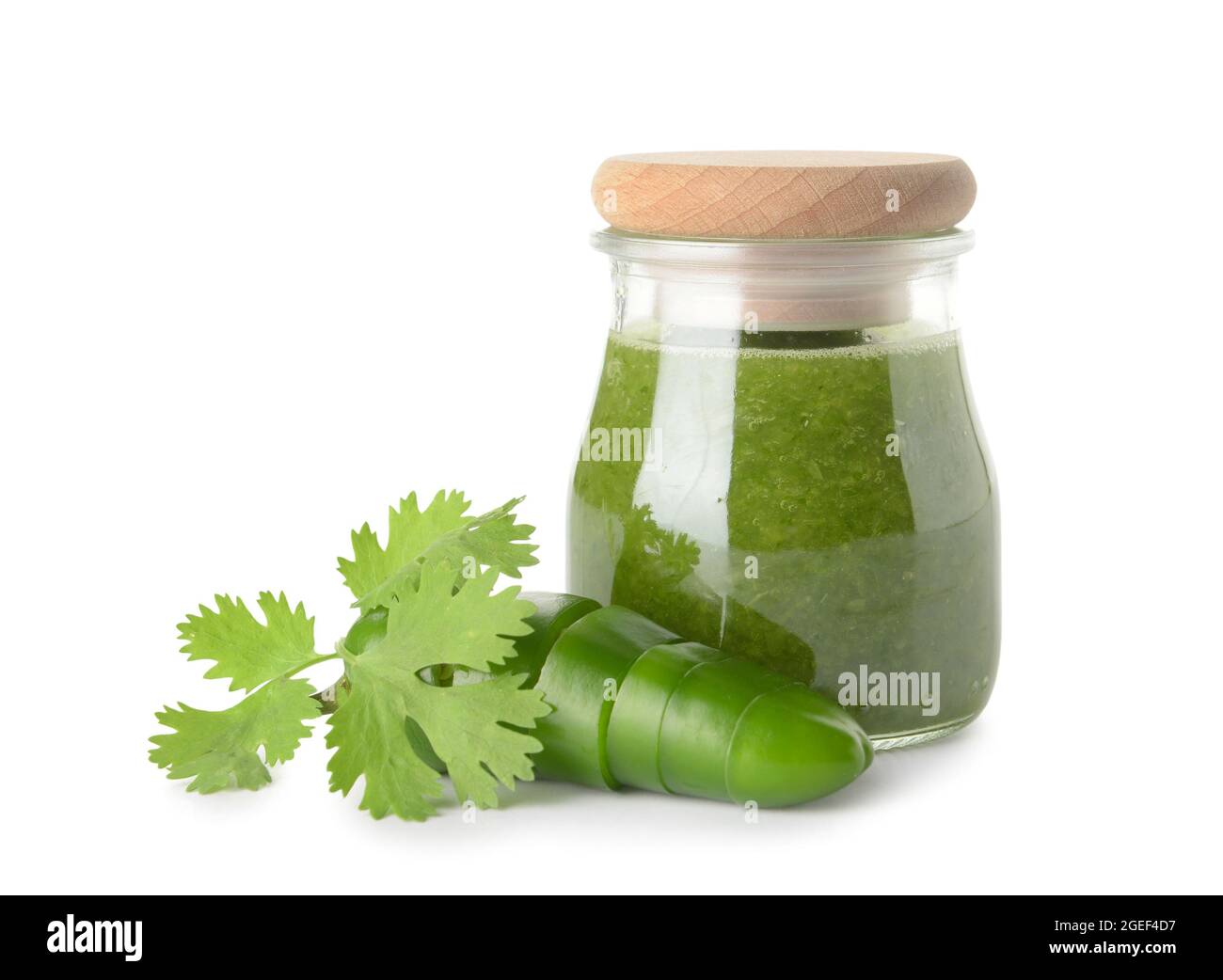 Glass jar of Tomatillo Salsa Verde sauce on white background Stock Photo