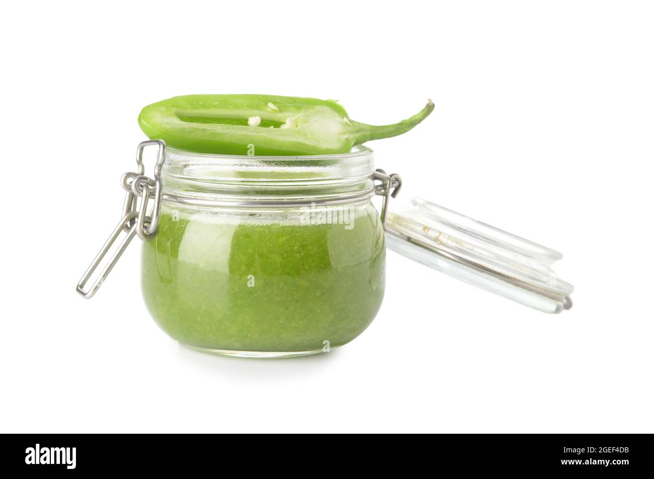 Glass jar of Tomatillo Salsa Verde sauce on white background Stock Photo