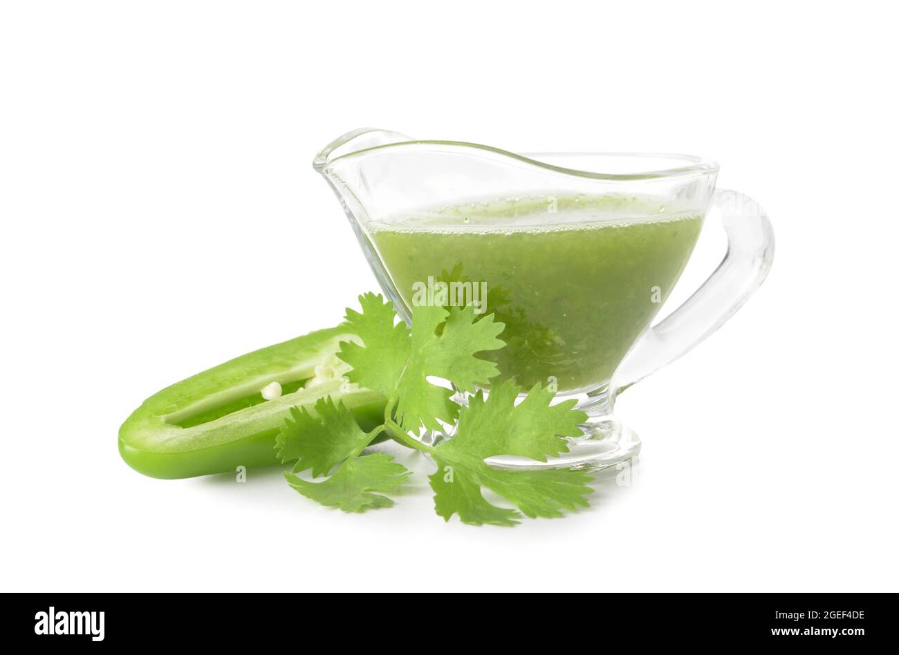 Jug of Tomatillo Salsa Verde sauce on white background Stock Photo