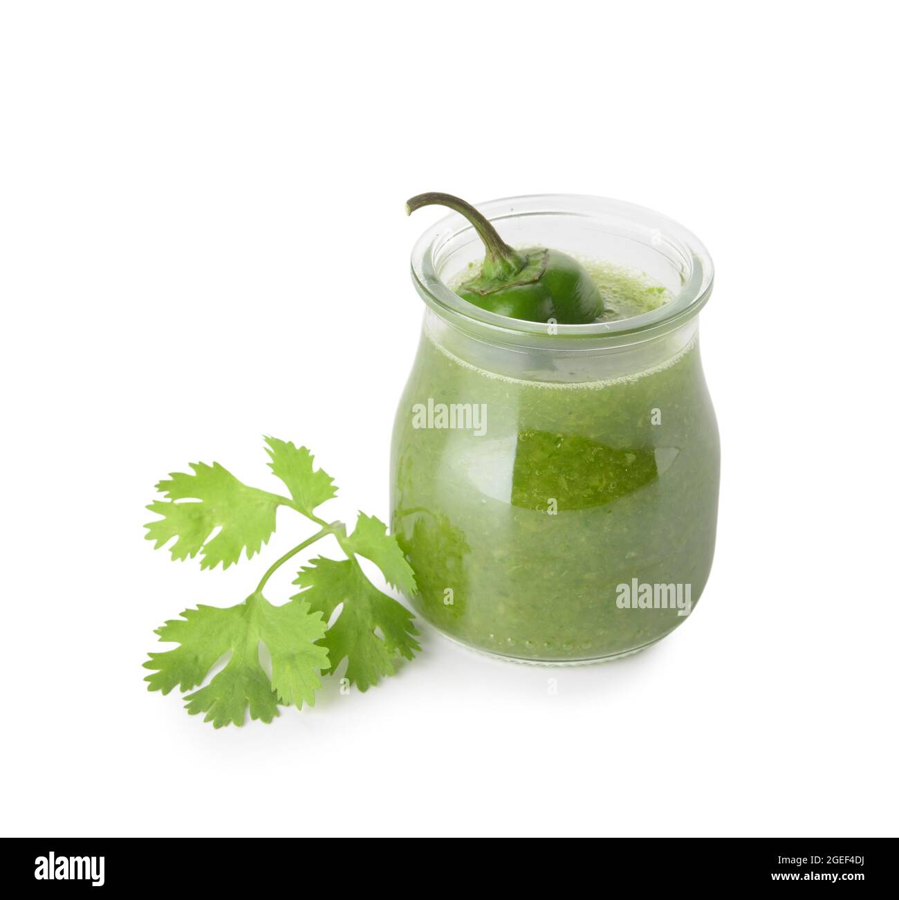 Glass jar of Tomatillo Salsa Verde sauce on white background Stock Photo