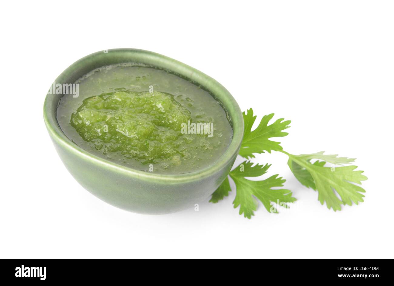 Bowl of Tomatillo Salsa Verde sauce on white background Stock Photo