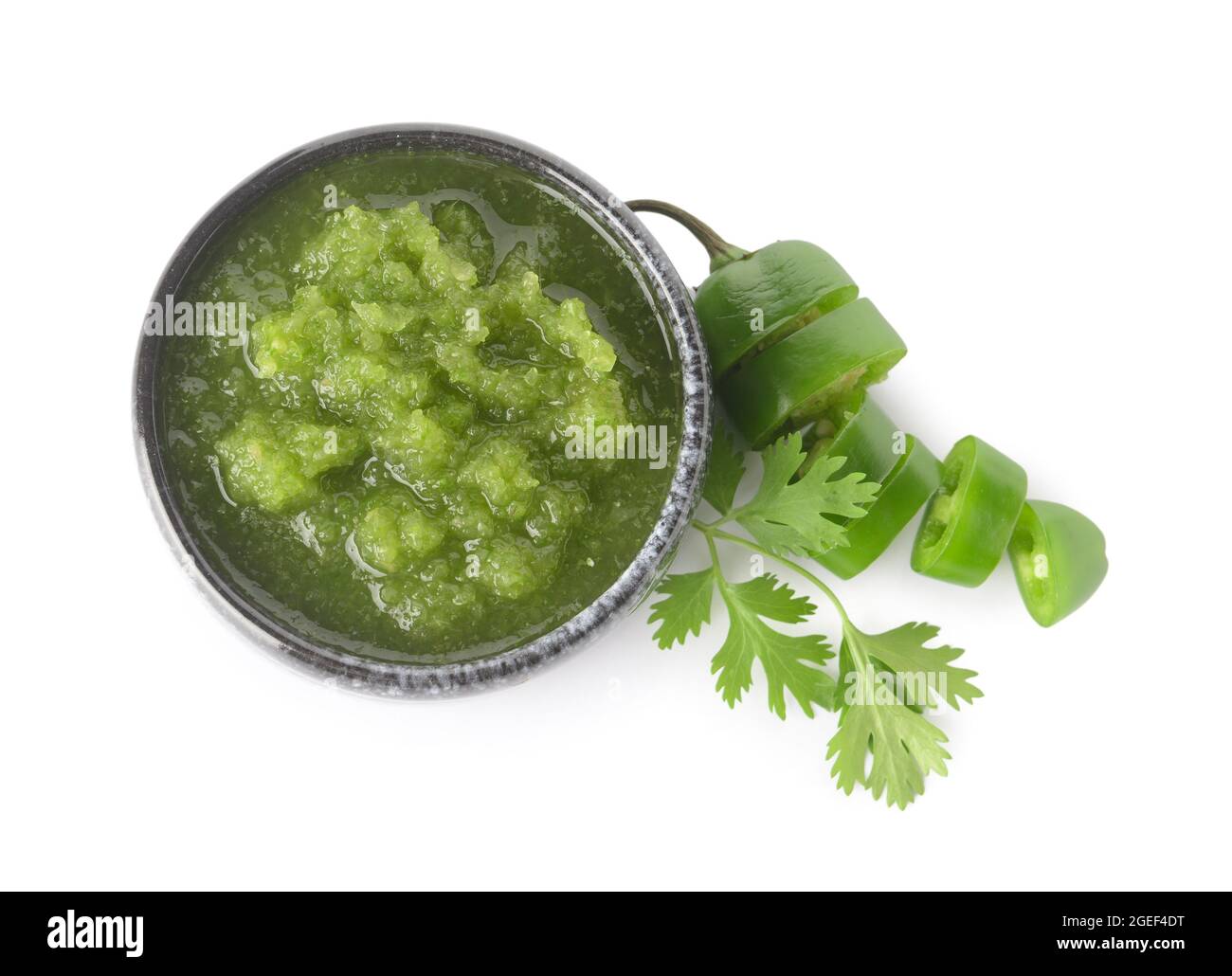 Bowl of Tomatillo Salsa Verde sauce on white background Stock Photo