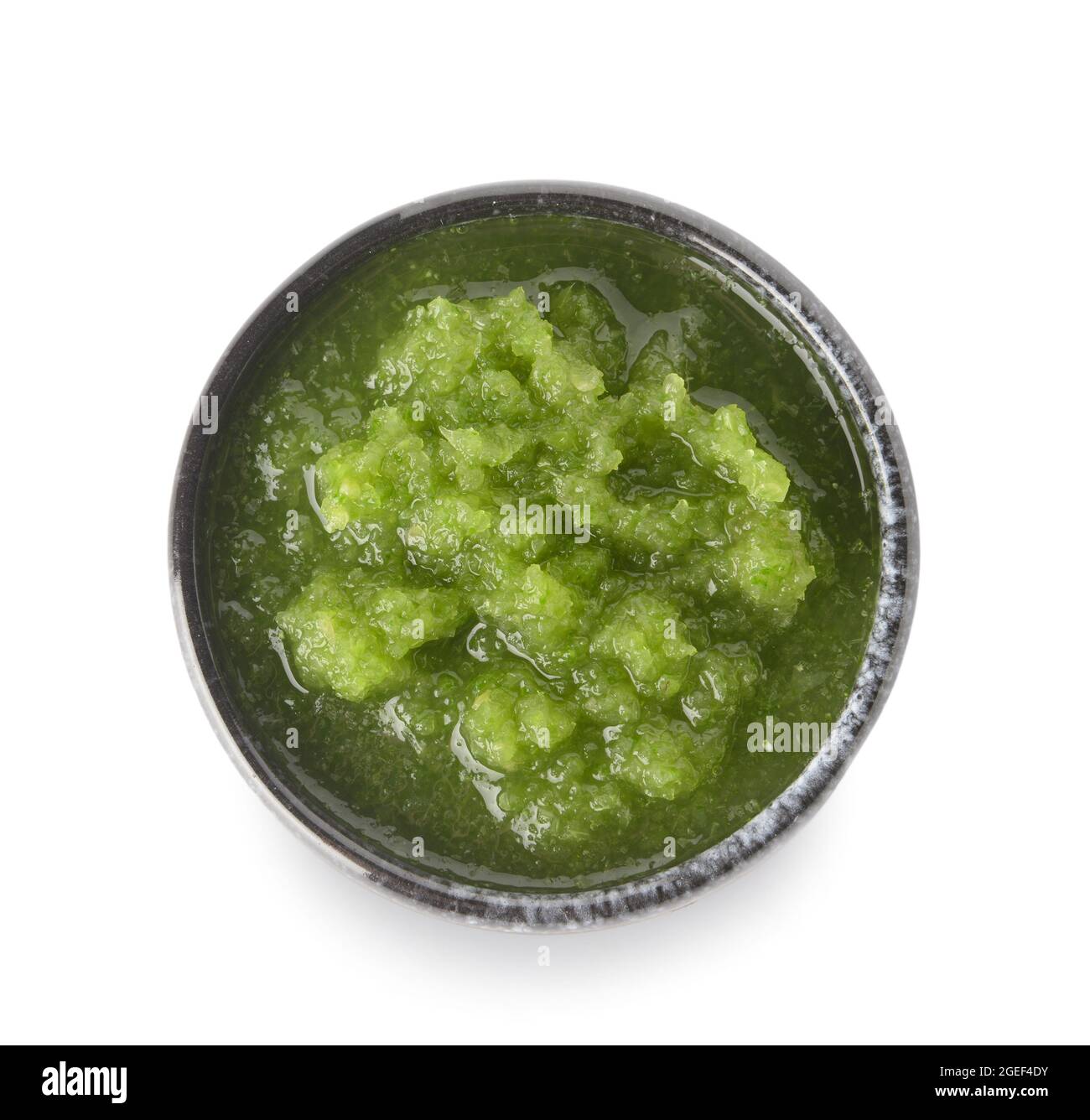Bowl of Tomatillo Salsa Verde sauce on white background Stock Photo