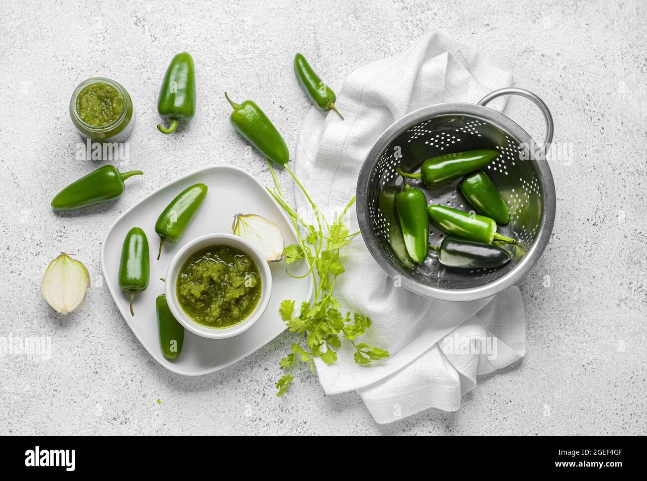 Composition with Tomatillo Salsa Verde sauce on light background Stock Photo