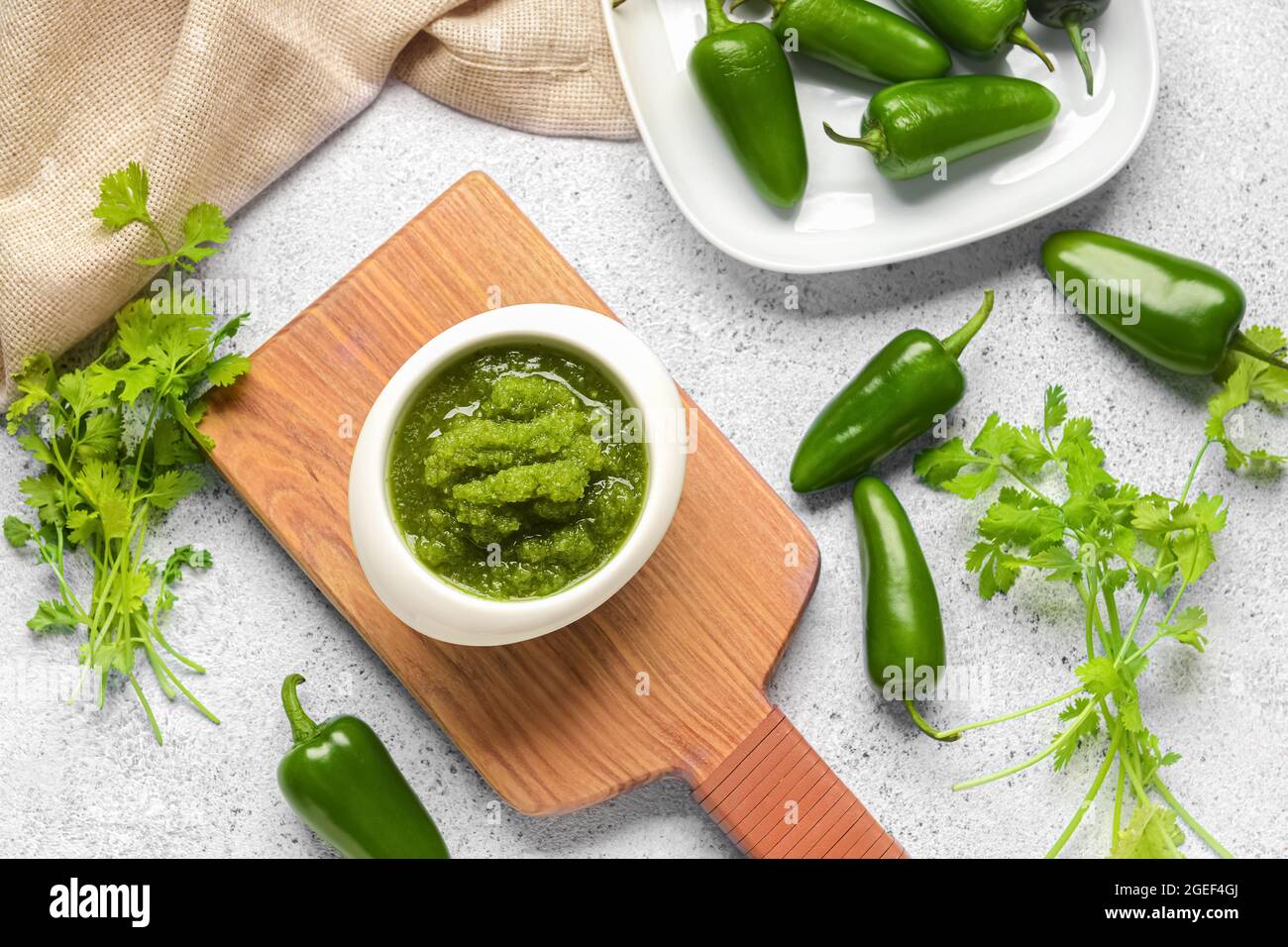 Composition with Tomatillo Salsa Verde sauce on light background Stock Photo