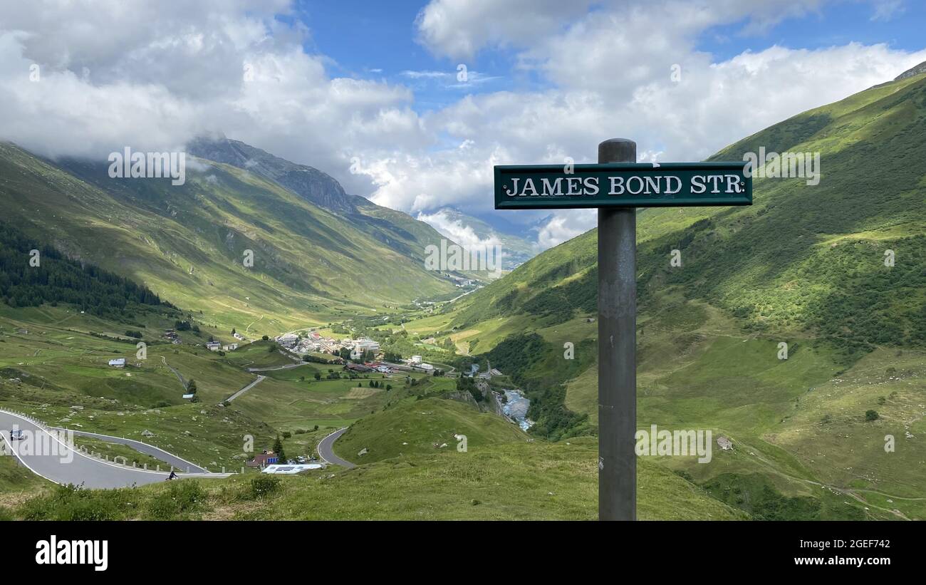James Bond Str sign post with beautiful Furka mountain pass on background in Realp, Switzerland Stock Photo