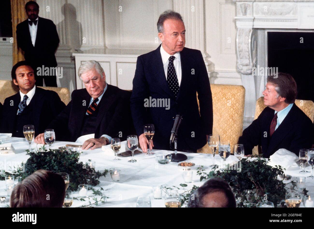 Prime Minister Yitzhak Rabin of Israel, right center, offers remarks at a working dinner in his honor hosted by United States President Jimmy Carter, right, in the State Dining Room of the White House in Washington, DC on Monday, March 7, 1977. Looking on is Speaker of the US House of Representatives Tip OâNeill (Democrat of Massachusetts), left center, and US Ambassador to the United Nations Andrew Young. Credit: Benjamin E. 'Gene' Forte/CNP Stock Photo