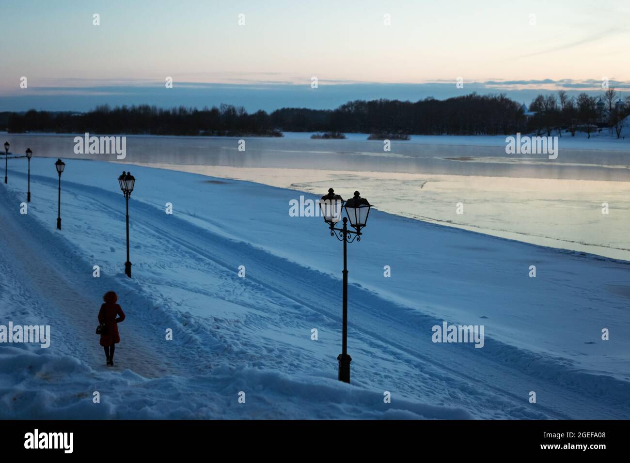 Winter view of the river with icy edges and snow-covered banks in winter. Nice side view Stock Photo