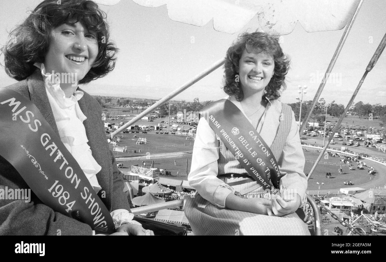 GATTON, QUEENSLAND, AUSTRALIA, JULY, 1984: Two young women - the Gatton Showgirl, and the Belle of the Ball - ride the ferris wheel at the annual A and P show in Crow's Nest, Queensland, 1984. Scanned from original negatives for newspaper publication. Stock Photo