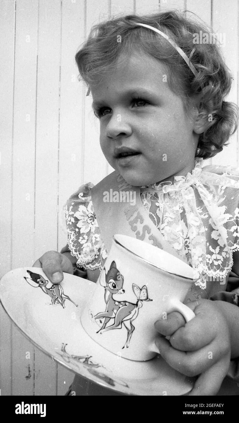 CROW'S NEST, QUEENSLAND, AUSTRALIA, MAY, 1984: A young girl chosen to the Show tiny tot at the annual A and P show in Crow's Nest, Queensland, 1984, shows off her prize. Scanned from original negatives for newspaper publication. Stock Photo
