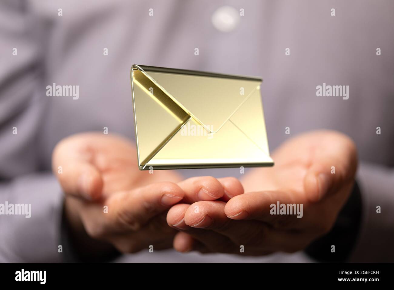 Businessman with open hands holding a floating email icon Stock Photo ...