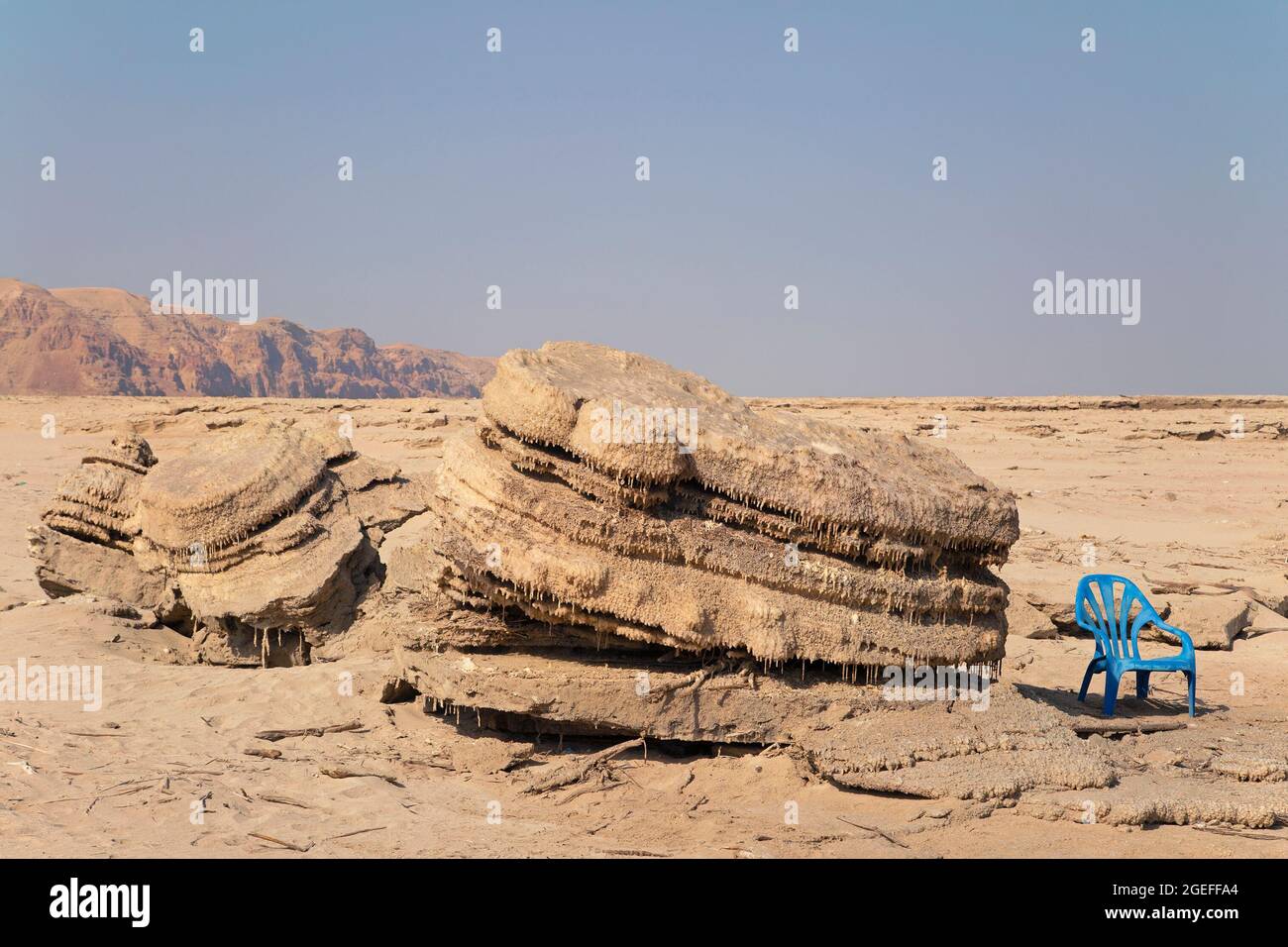 Salt chimneys left above water on dry land by declining water level along the Dead Sea shoreline. Stock Photo