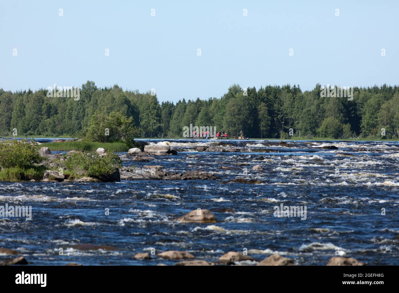 KUKKOLAFORSEN, SWEDEN ON JULY 02, 2021. View of the river upstreams. Guided tour on the river. Editorial use. Stock Photo