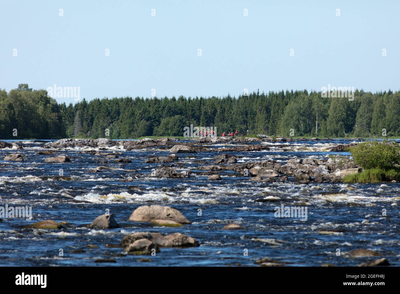 KUKKOLAFORSEN, SWEDEN ON JULY 02, 2021. View of the river upstreams. Guided tour on the river. Editorial use. Stock Photo