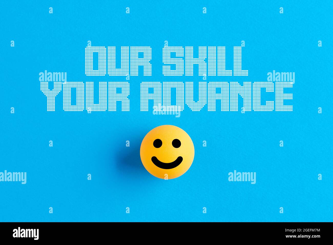 Smiling face icon on a ball with the message our skill your advance. Business consultancy concept. Stock Photo
