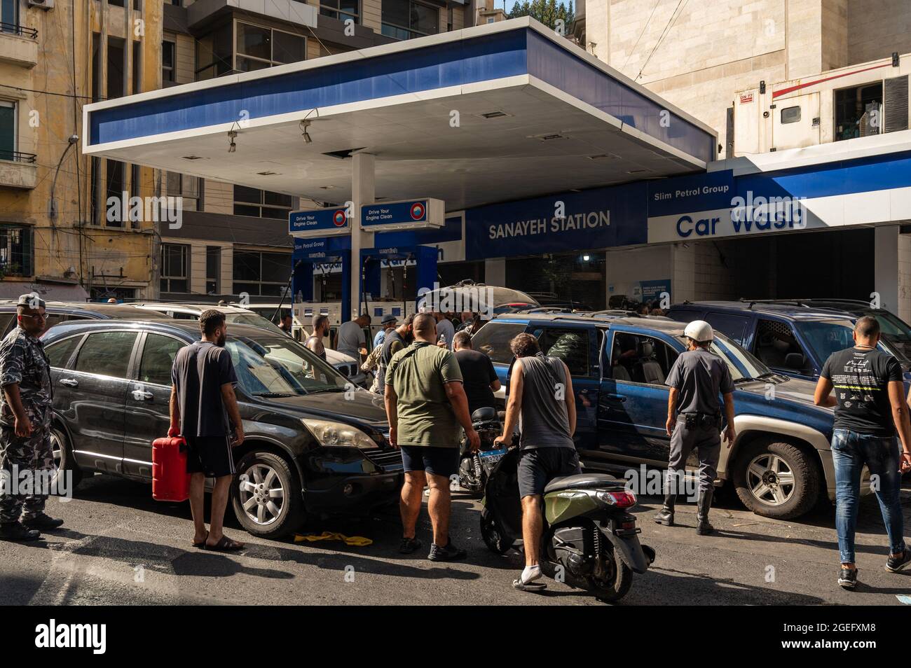 Chaos and soldiers as hundreds of Lebanese wait in line for fuel at a