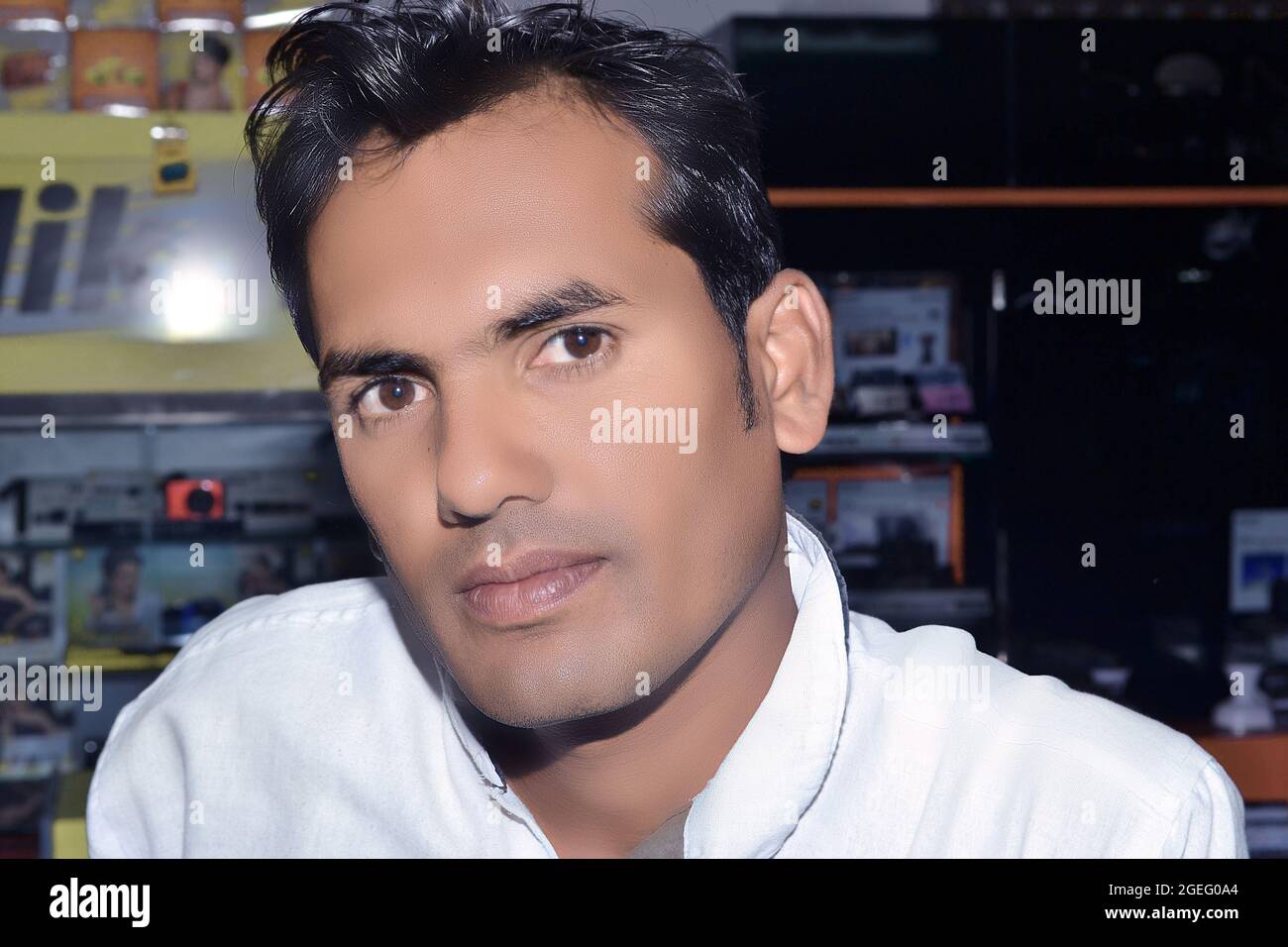 Indian man looking at the camera in a happy pose. Stock Photo